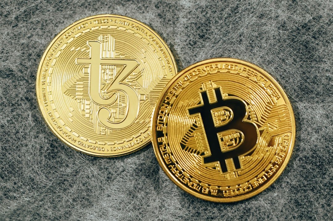 a bit coin sitting on top of a gray surface