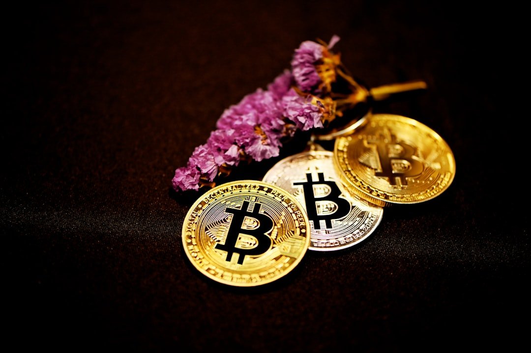 gold round coin on black textile