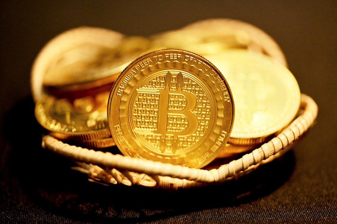 gold round coin on black textile