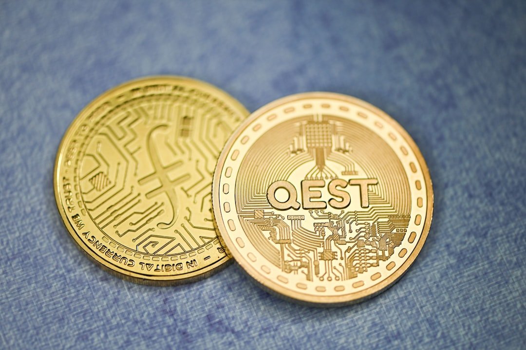 a close up of two gold coins on a blue surface