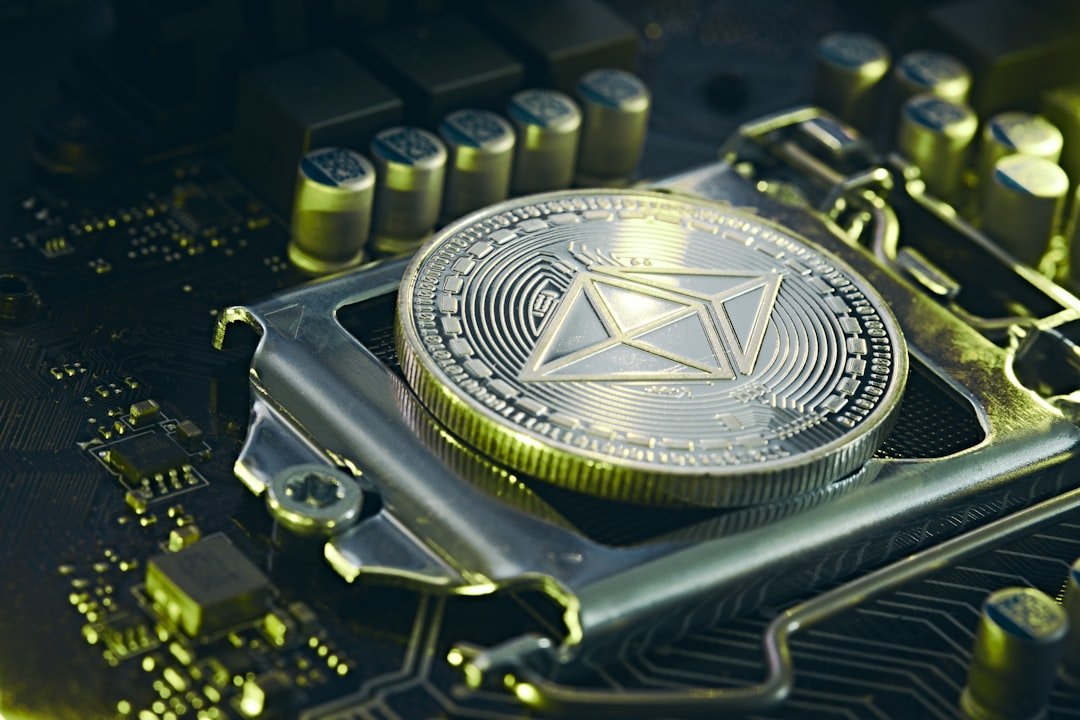 a bitcoin sitting on top of a computer motherboard