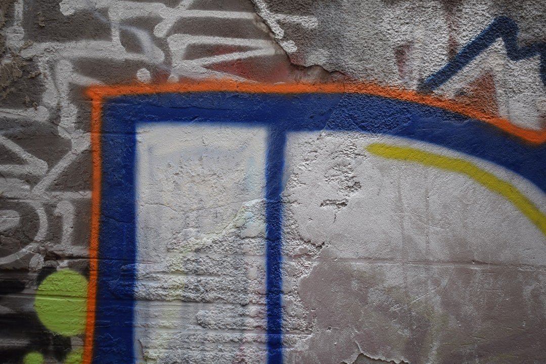 Graffiti art on a textured concrete wall