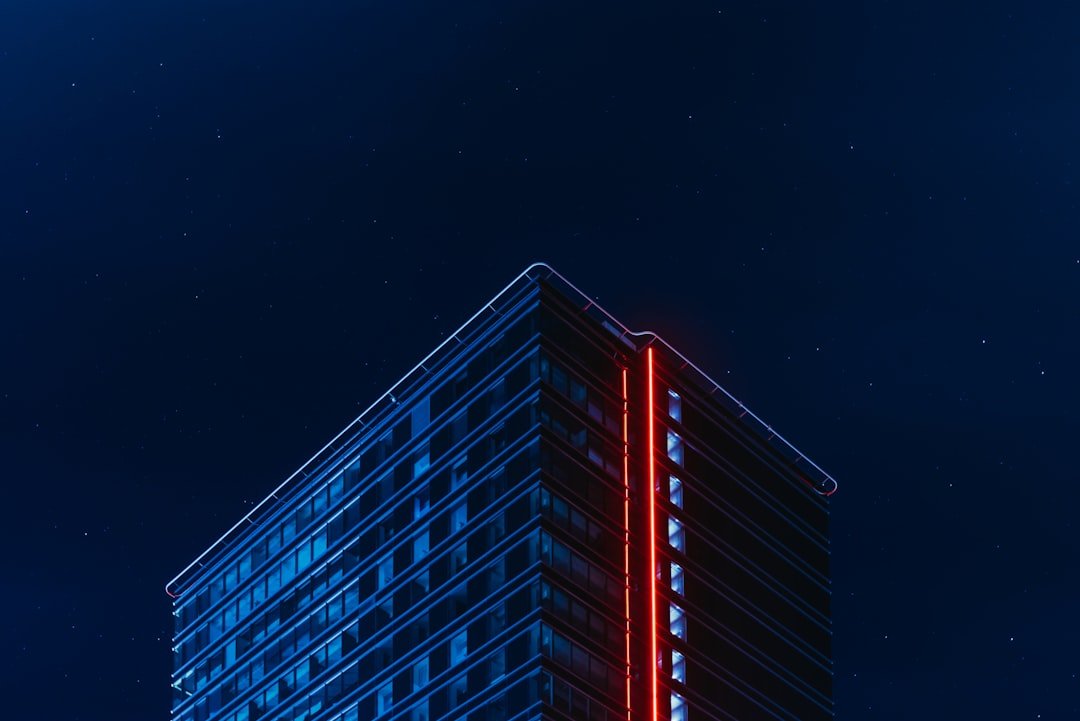 blue and red glass building during night time