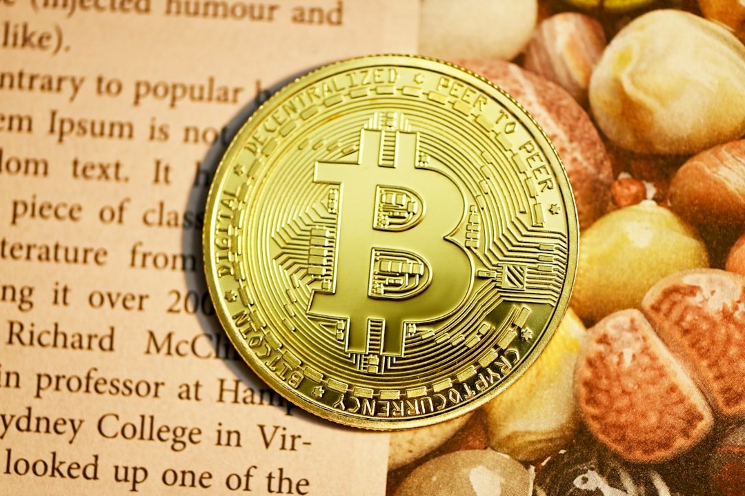 gold round coin on white paper