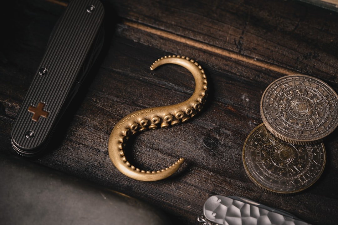 a close up of a metal object on a wooden surface