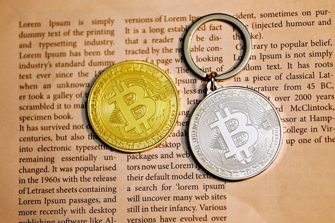 silver round coin on white printer paper