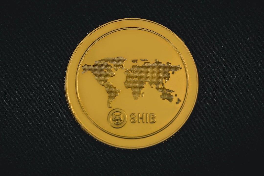 a gold coin with a world map on it