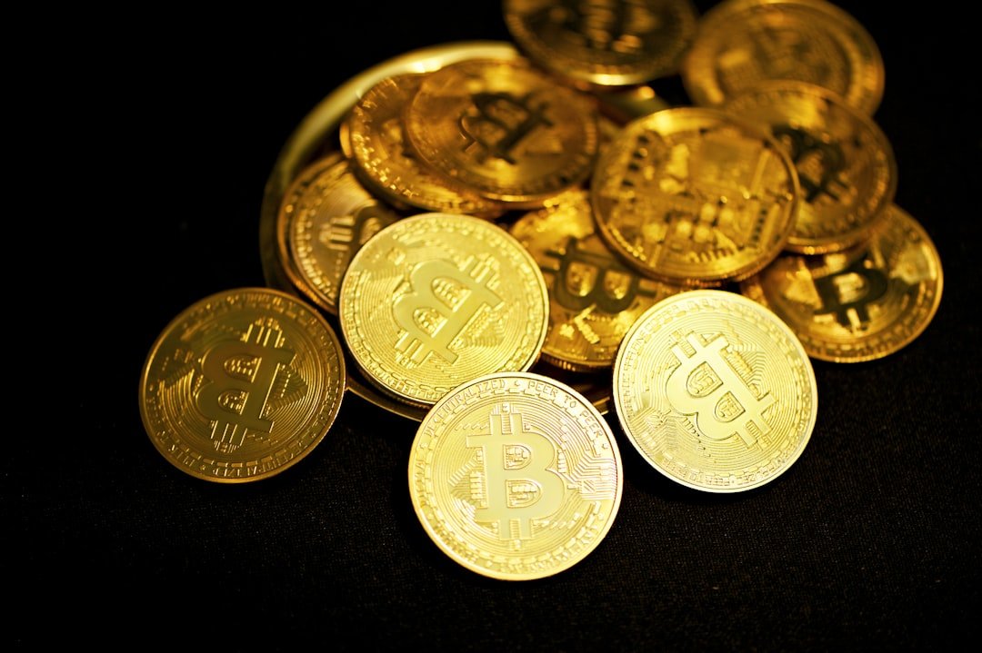 gold round coins on black surface