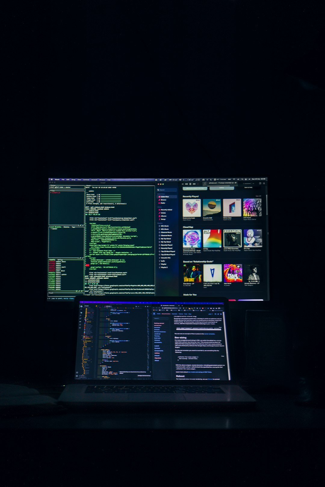 a laptop computer sitting on top of a desk