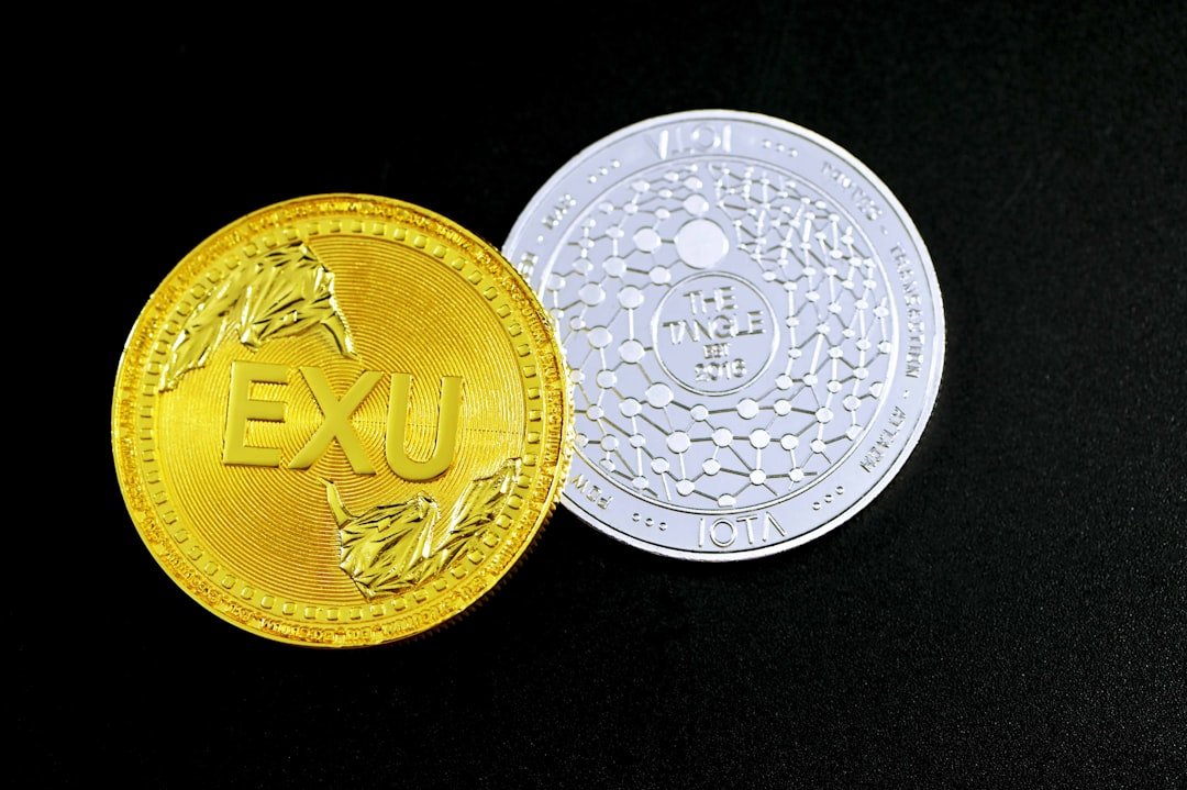 gold round coin on black textile